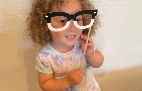 Girl Posing with Large Fake Glasses